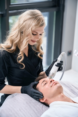 Microneedling treatment in a clinic.