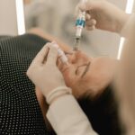 Professional medical practitioner performing a microneedling treatment on a patient's face for skin rejuvenation.