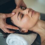 Professional aesthetician performing a Skinwave Hydro Facial treatment on a patient for deep skin hydration and cleansing.